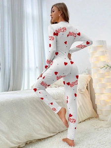 Detail of red heart and LOVE letter print on white long sleeve slim fit jumpsuit