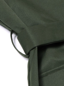 Detailed macro view of army green twill fabric waist belt loop and fine stitching finish