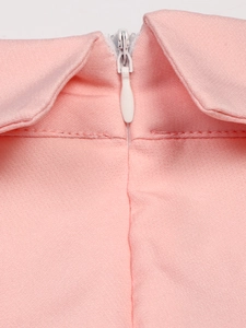 Detailed close-up of a pink dress featuring a high-quality white invisible zipper closure
