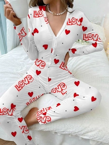 Close-up of white bodysuit with red hearts and Love print with buttoned V-neckline