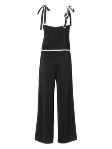 Damen Jumpsuit in Schwarz mit weiten Beinen, weißer Paspelierung und Schleifenträgern