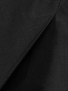 Close-up of black twill fabric detailing the refined stitching and slit structure of the dress