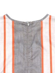 Detail of round neckline with hidden zipper on striped jumpsuit for women