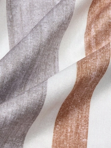 Close-up of striped fabric texture in white and reddish brown for a summer dress