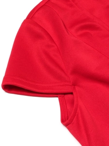 Detail shot of high-quality red knit fabric and double-needle stitching on the cuff