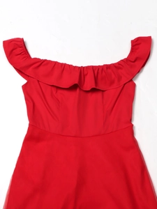 Detail of red off-the-shoulder dress featuring layered ruffles and elasticated neckline