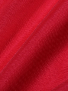 Macro shot of vibrant red evening gown fabric showing fine mesh texture and silk luster