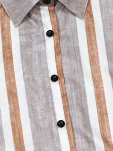 Close-up of vertical striped linen texture and black buttons on a casual maxi dress
