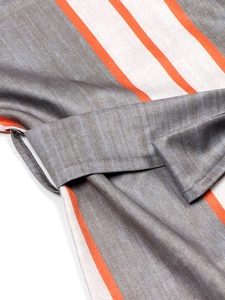 Detail of the waist belt loop and striped fabric texture on the casual jumpsuit