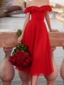 Elegant red off-shoulder evening dress with ruffled neckline and layered mesh skirt