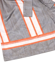Women's casual striped jumpsuit featuring orange and grey geometric patterns and waist tie