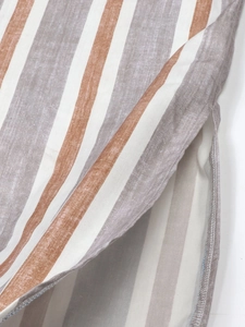 Relaxed vertical striped shirt dress featuring a side slit and premium stitching details
