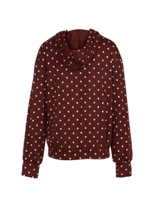 Detail view of the back of a hooded polka dot jacket with ribbed cuffs and hemline