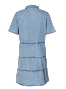 Detail view of tiered layered back design on light blue short sleeve denim dress