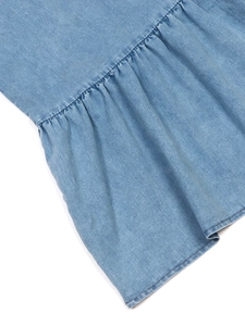 Light blue denim summer dress with deep V-neck and elegant pleated details in long flowy style