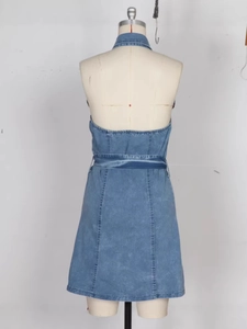 Blue denim halter backless dress with a cinched waist and vintage wash A-line silhouette