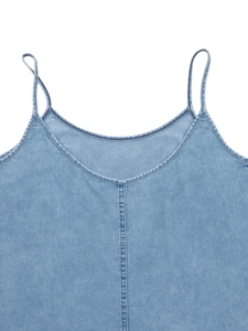 Detail of light blue washed denim camisole with thin straps and vertical stitching