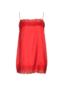Detailed view of red satin camisole dress with delicate lace trim on hem and neckline