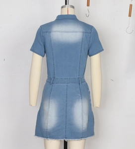 Rear view of light blue denim mini dress with washed finish and frayed hem details