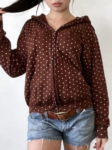 Polka dot zip-up hoodie in brown paired with denim shorts for women's casual style