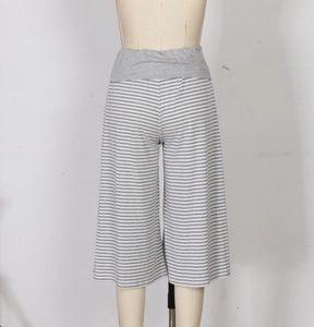Detail of high-waisted wide leg pants with grey stripes and elastic waistband comfort