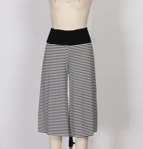 Detailed view of high-waisted black and white striped wide-leg cropped pants with elastic waist