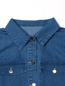 Front view of denim shirt dress with point collar and silver buttons on white background