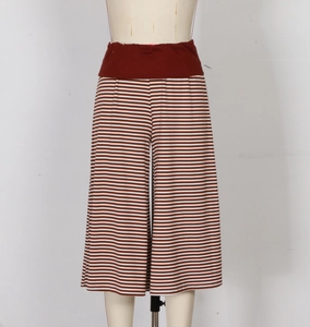 Detail of brown and white striped wide-leg pants with a comfortable elastic waistband