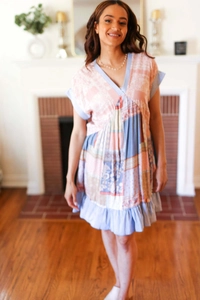 Detail of V-neckline and patchwork floral patterns on casual bohemian summer dress