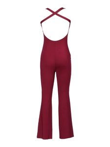 Detail of cross straps on back and flared legs of burgundy backless jumpsuit