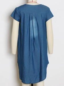 Detail view of the back of blue denim dress featuring triple back pleats and washed effect
