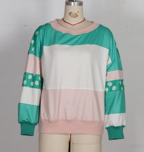 Close-up of color-block sweatshirt featuring floral print stripes and ribbed knit cuffs