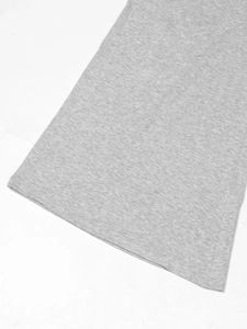 Detailed macro view of the grey marl knit fabric texture and high-quality hem stitching