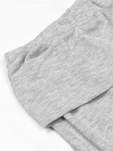 Macro shot of grey marl knit fabric showing soft texture and premium stitching details