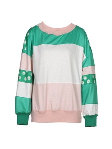 Detail of color block sweatshirt with daisy floral print on sleeves and ribbed cuffs
