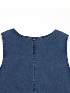 Detail of dark blue denim dress showing back neckline with double-stitch craftsmanship