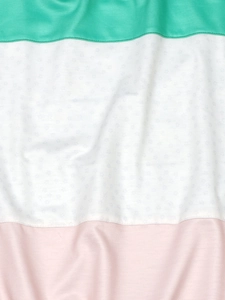 Macro detail of striped sweatshirt showing mint green, floral print, and pink knit fabric