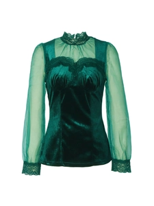 Detail of dark green velvet top featuring sheer mesh sleeves and delicate lace trim