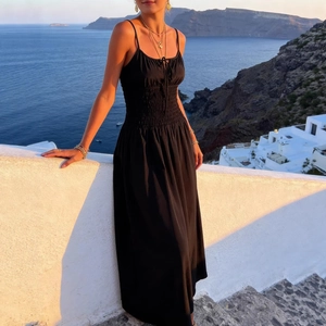Elegant black A-line midi sundress with spaghetti straps and smocked waist detail