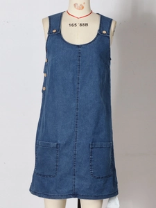 Sleeveless dark blue denim dress with round neck and side buttons on white background