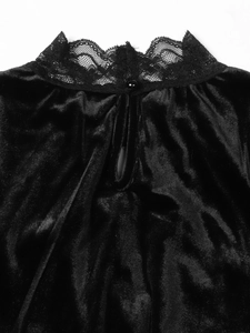 Detail of high neck black velvet top with lace trim and back button closure teardrop opening