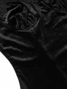 Close-up of black velvet top with elegant lace trim detailing on the sleeve neckline