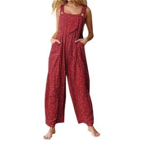 Detail of red floral overalls with wood-style buttons and large functional side pockets