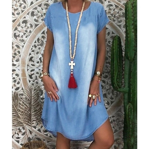 Detail of light blue denim summer dress featuring washed texture and casual loose fit