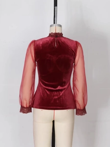 Elegant burgundy velvet slim fit top with sheer mesh sleeves and delicate lace trim