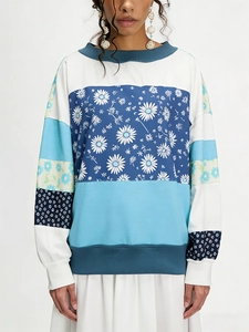 Women's color block sweatshirt featuring daisy floral print and long sleeves