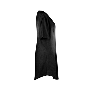 Detail view of the curved hemline and linen texture on this black casual denim dress