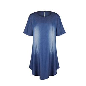 Detail of blue denim dress showing central washed fading and minimalist crew neck line