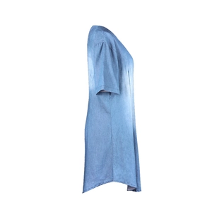 Detailed side view of light blue denim-texture summer dress with curved split hem
