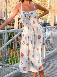White backless A-line maxi dress with floral shell print and smocked waist detail